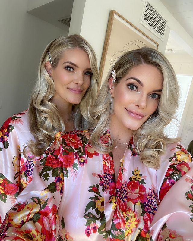 Lauren Wirkus and Ashley Wirkus in red floral printed pink night gown.